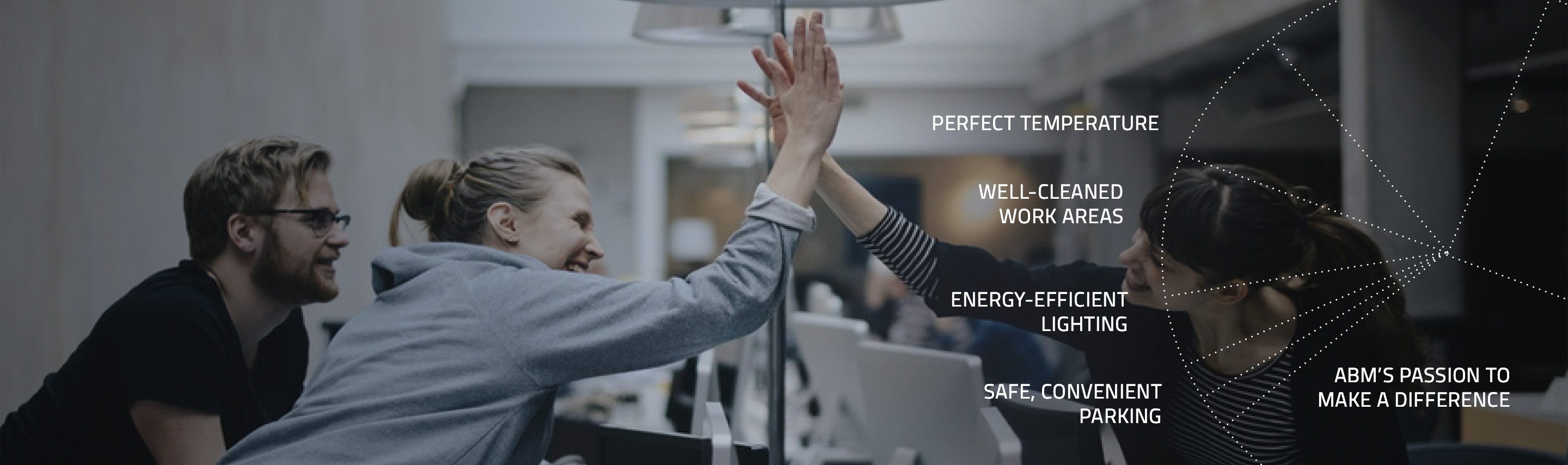 team workers in an office giving each other a high five
